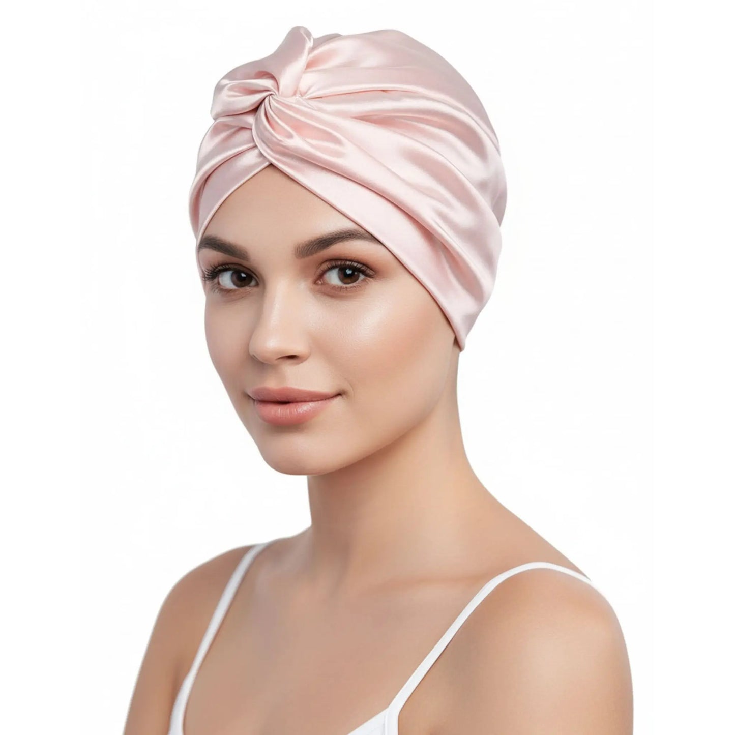 Woman wearing a pink silk turban on a white background