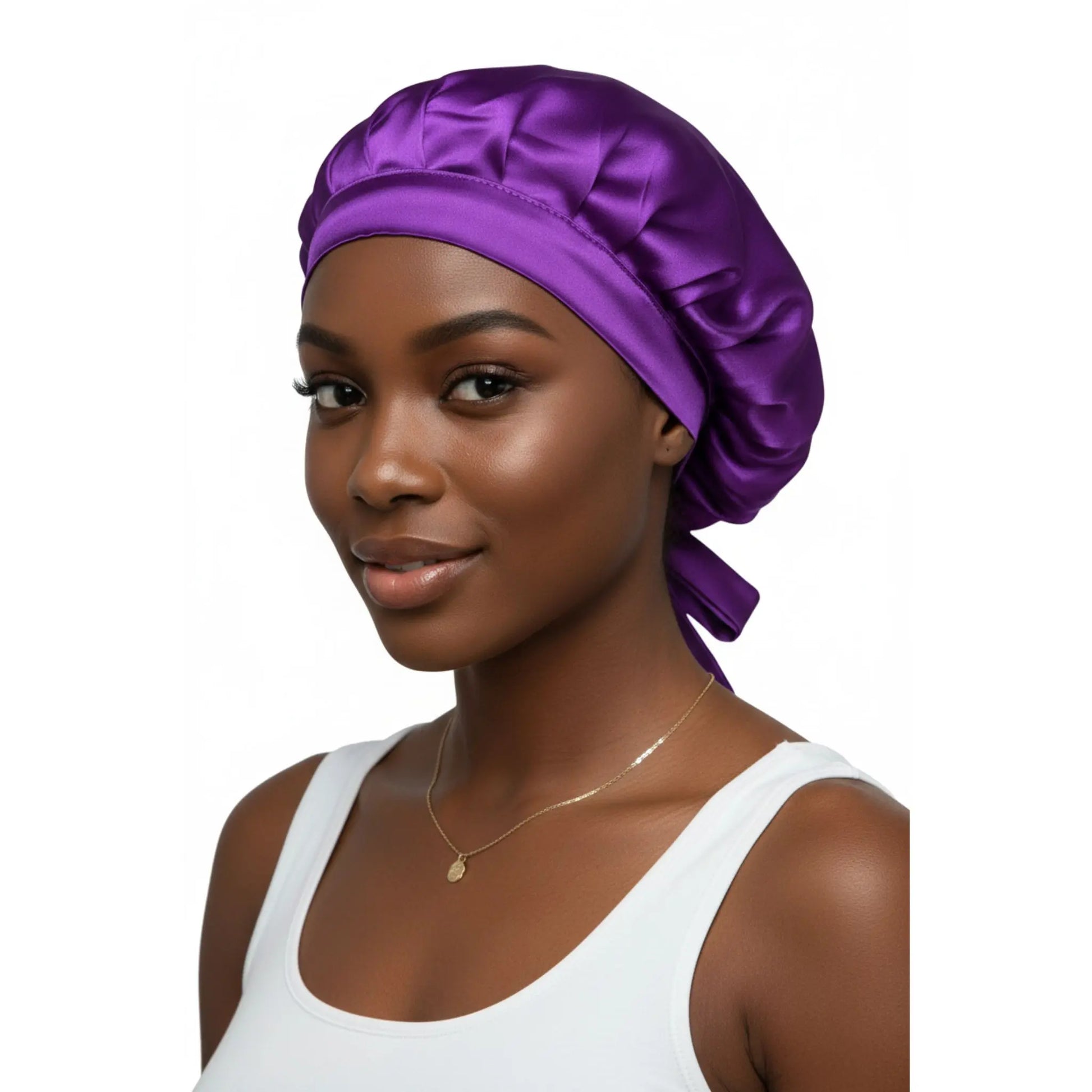 Woman wearing a purple silk head wrap on a white background