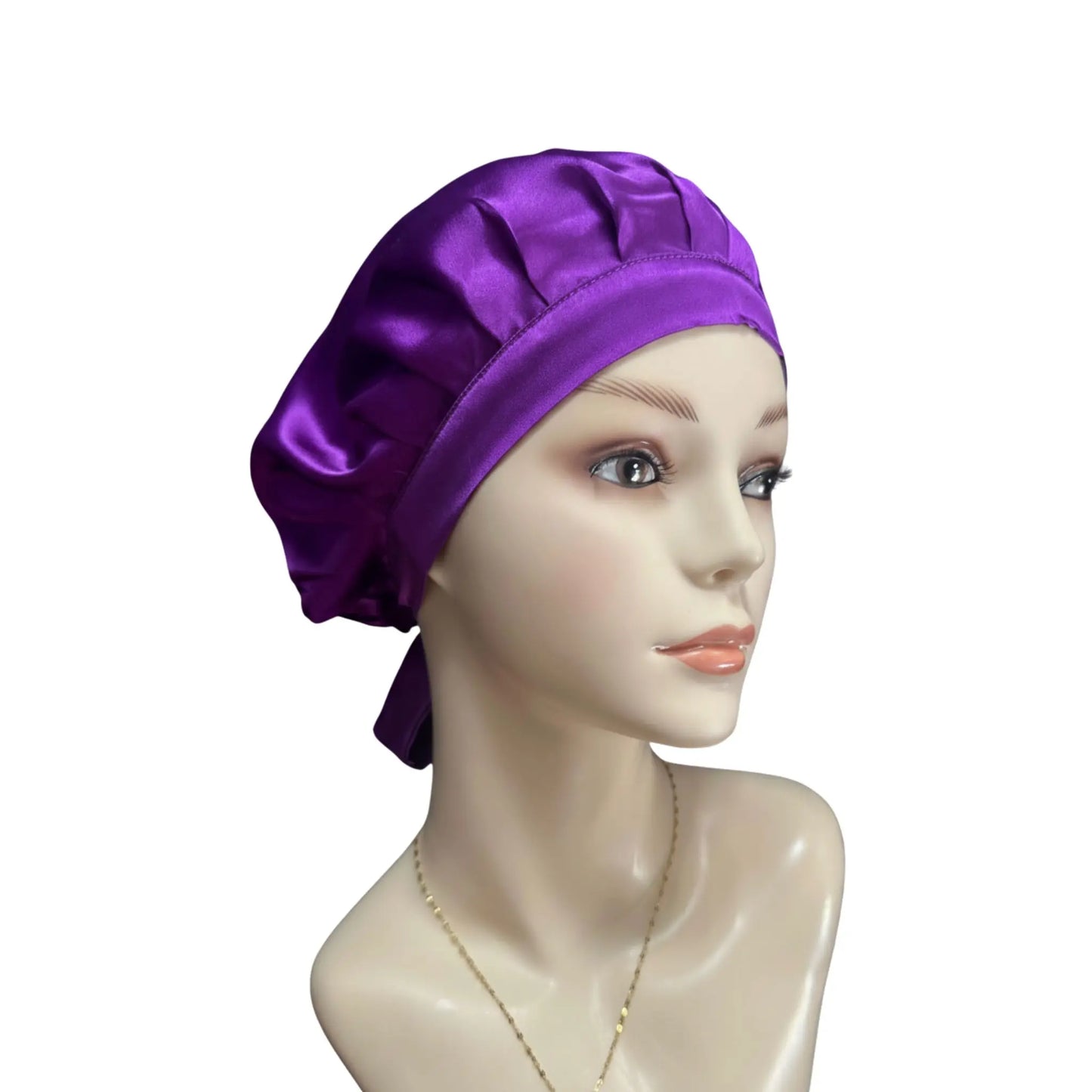 Purple satin head wrap on a mannequin head against a white background