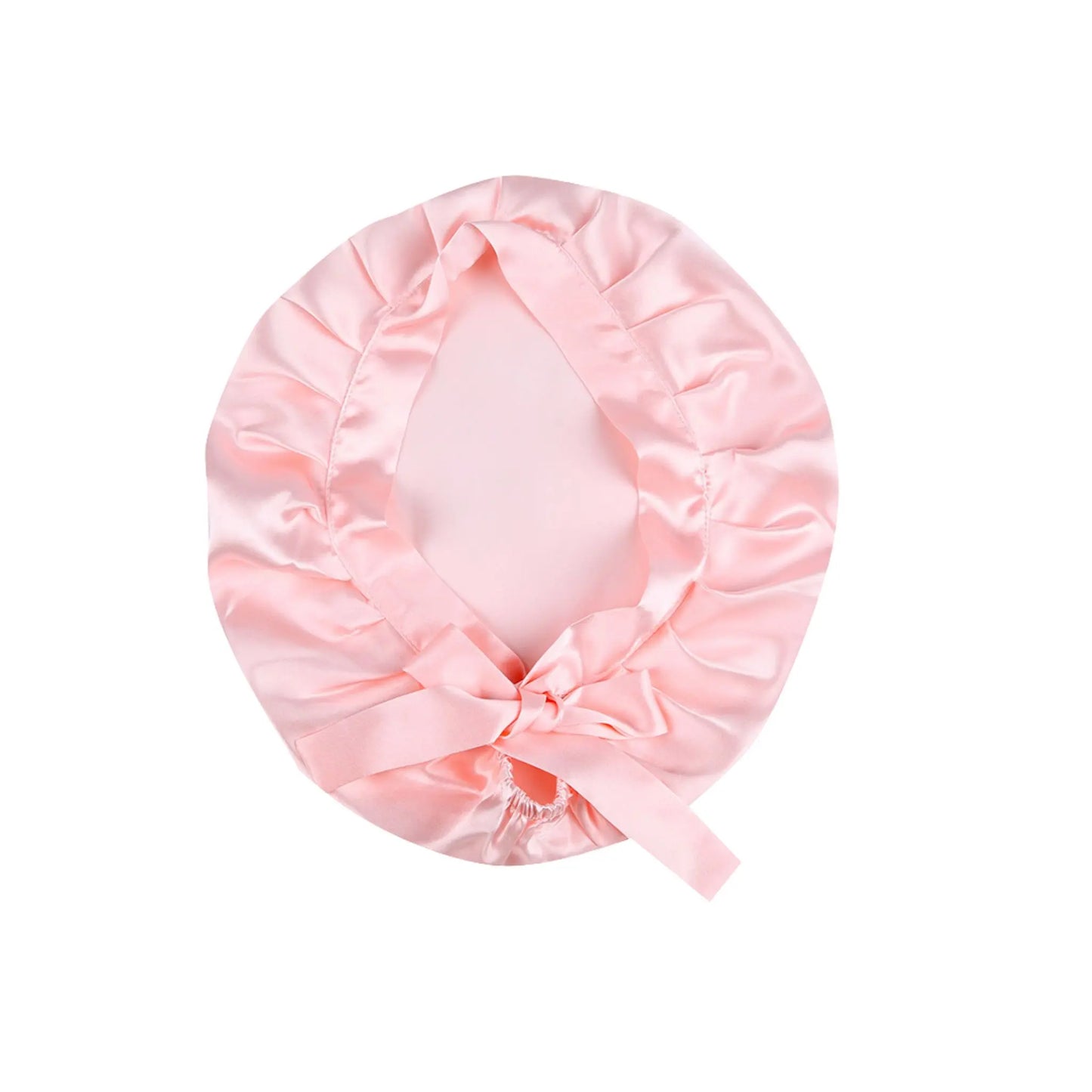 Pink silk bonnet on a white background