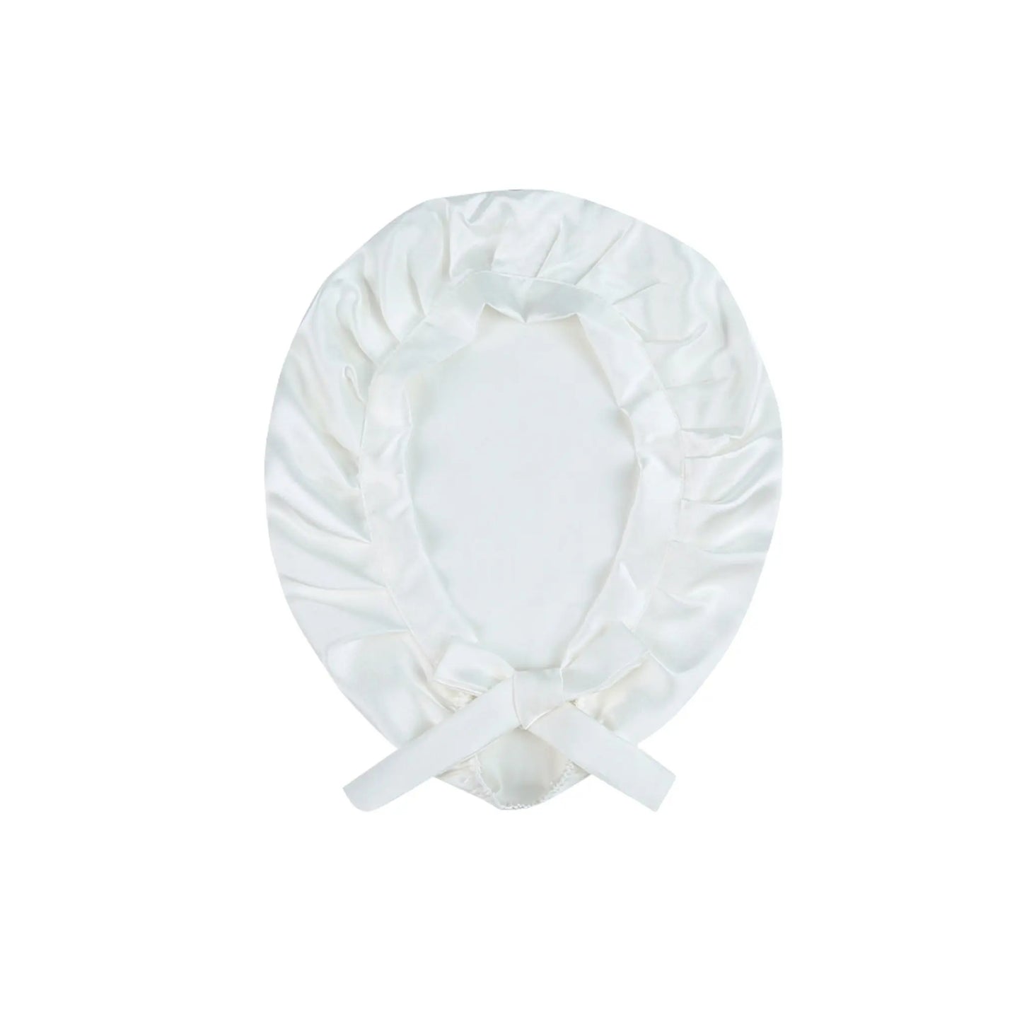 White silk bonnet with a bow on a white background