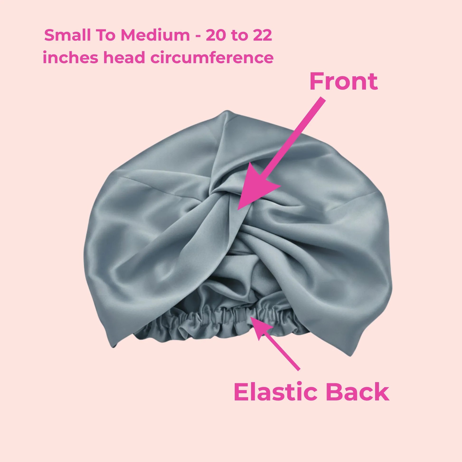 Blue silk bonnet with labeled front and elastic back on a pink background