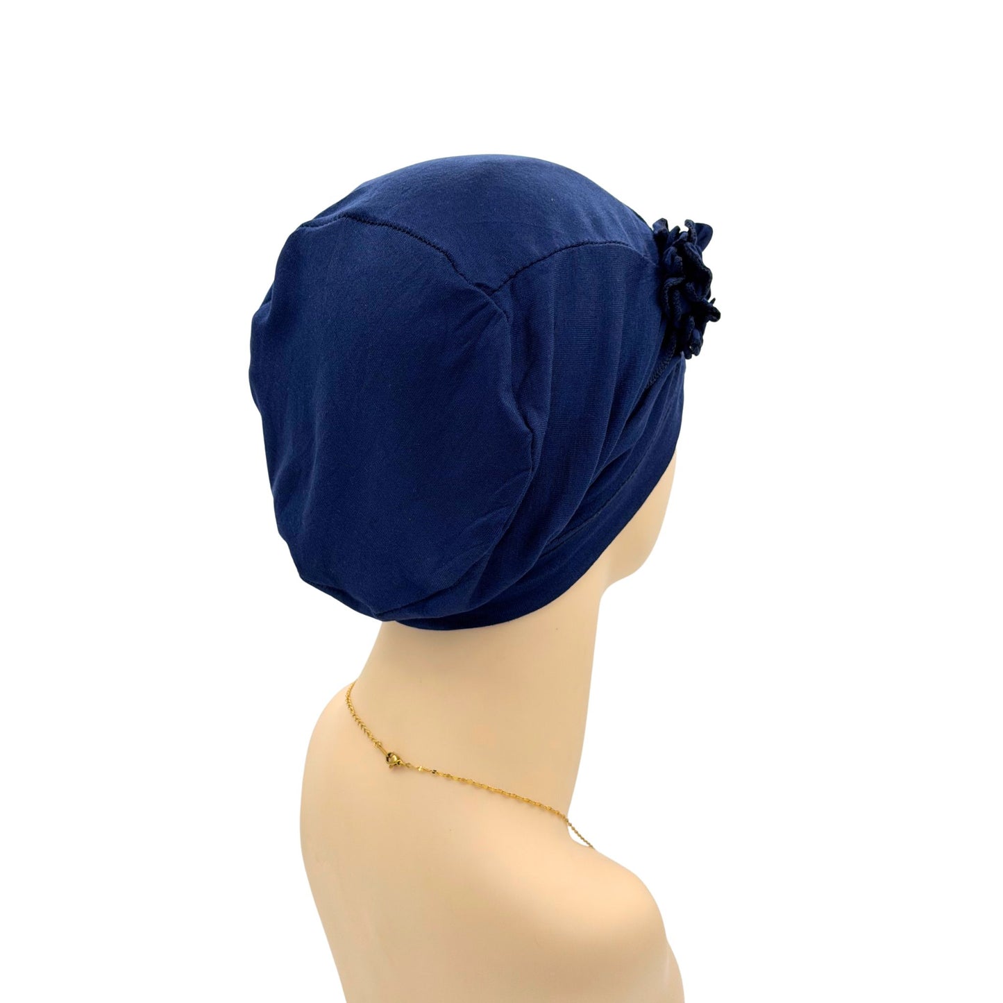 Navy blue chemo hat with a floral 