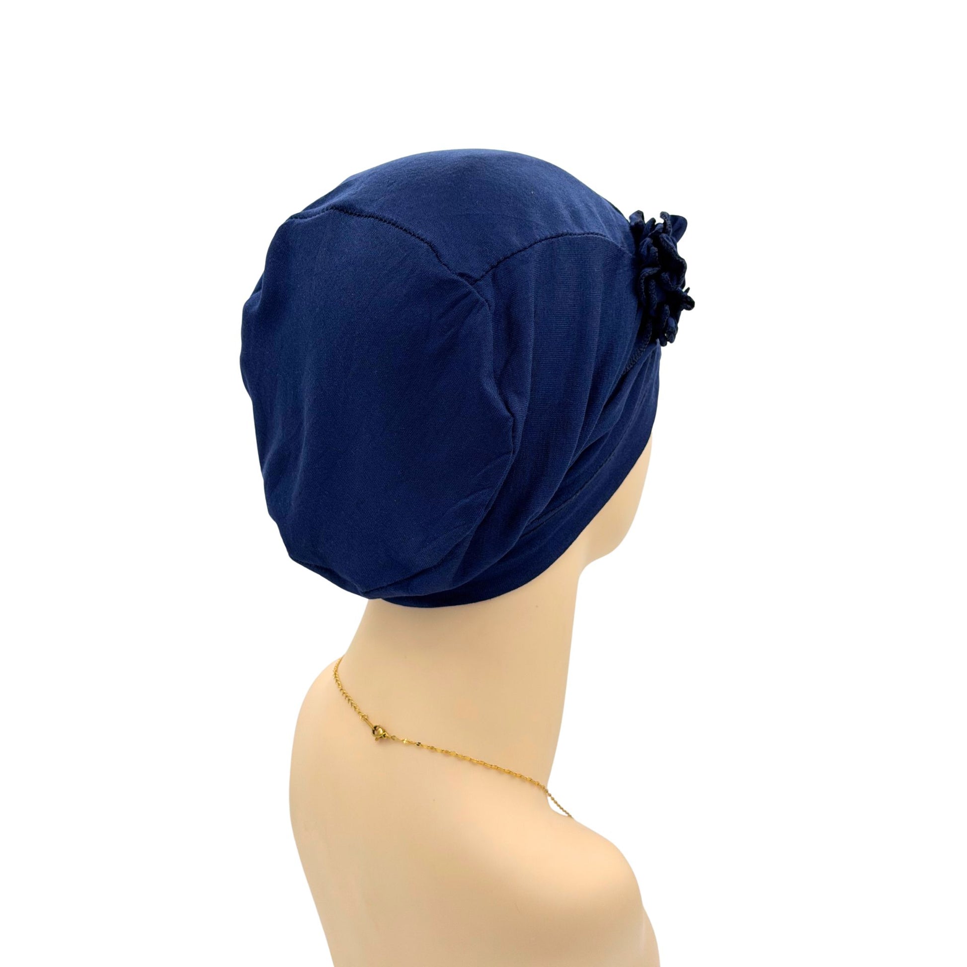 Navy blue chemo hat with a floral 