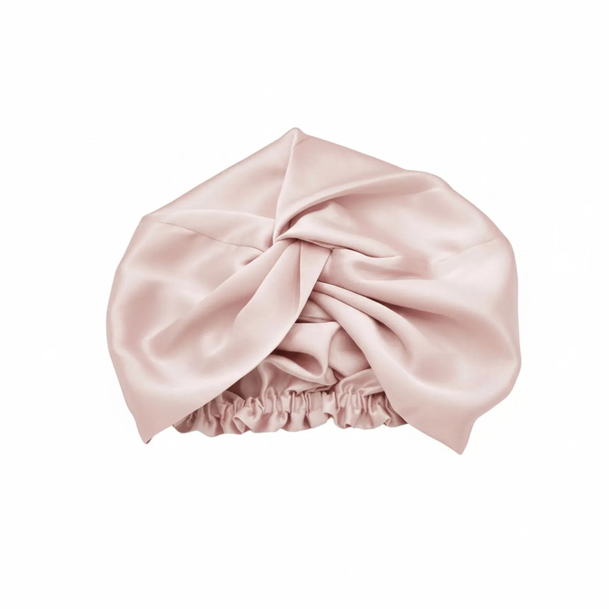 Pink silk bonnet on a white background