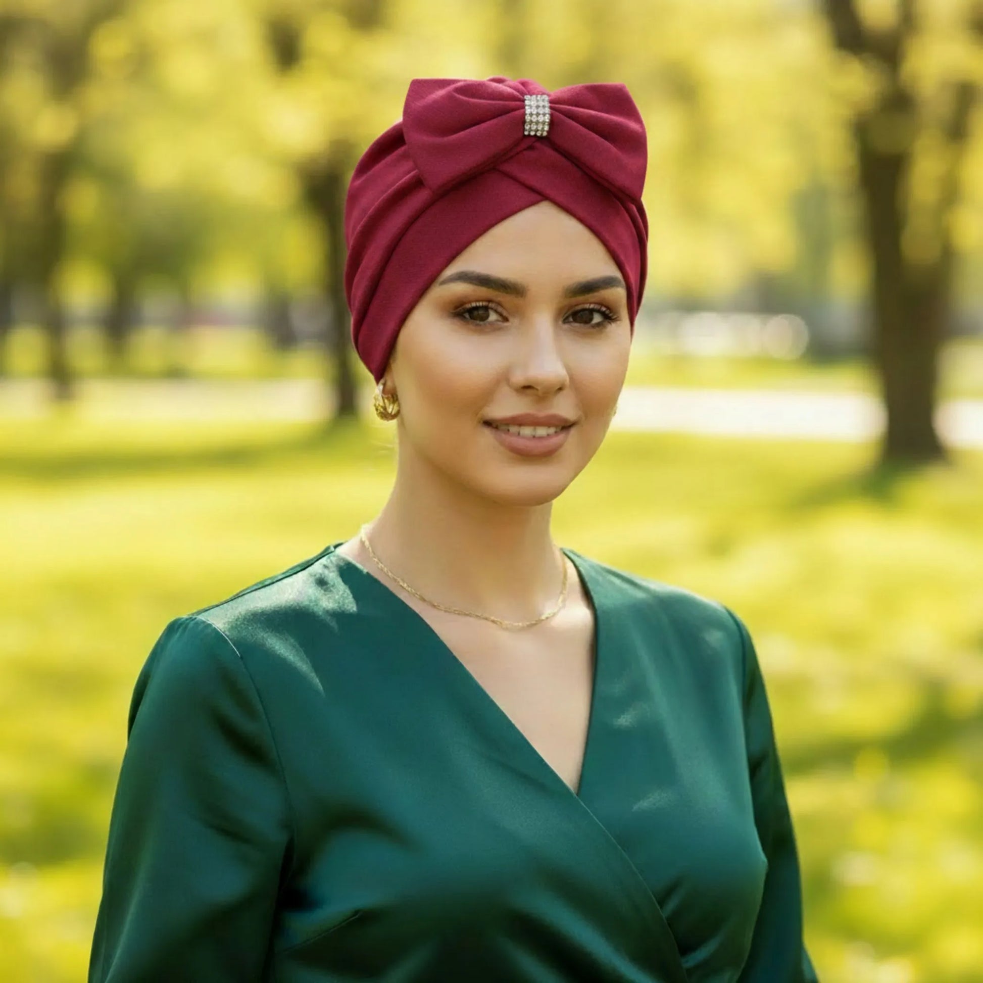 A woman wearing wine bow hat in an outside background