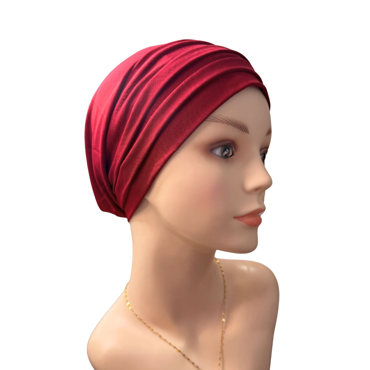 A mannequin wearing a wine red Chemo Head Wrap on a white background
