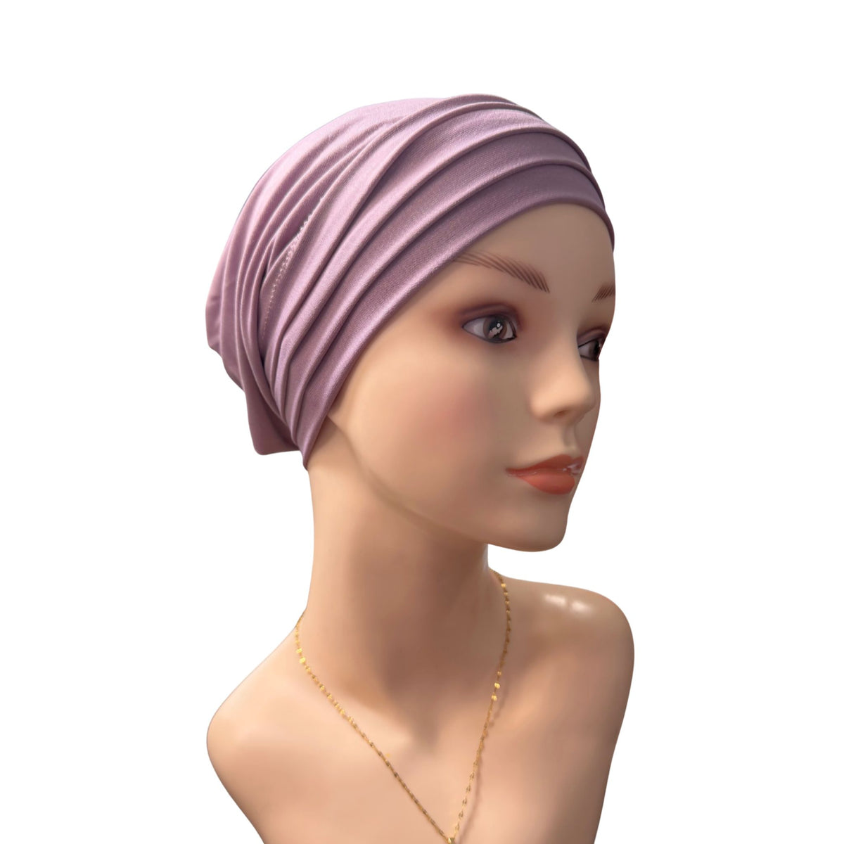 A mannequin wearing a light purple Chemo Head Wrap on a white background