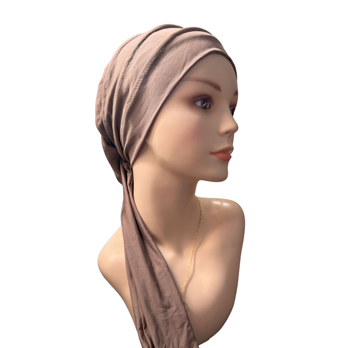 A Khaki fabric head wrap or hijab styled on a female mannequin bust against a plain white background.