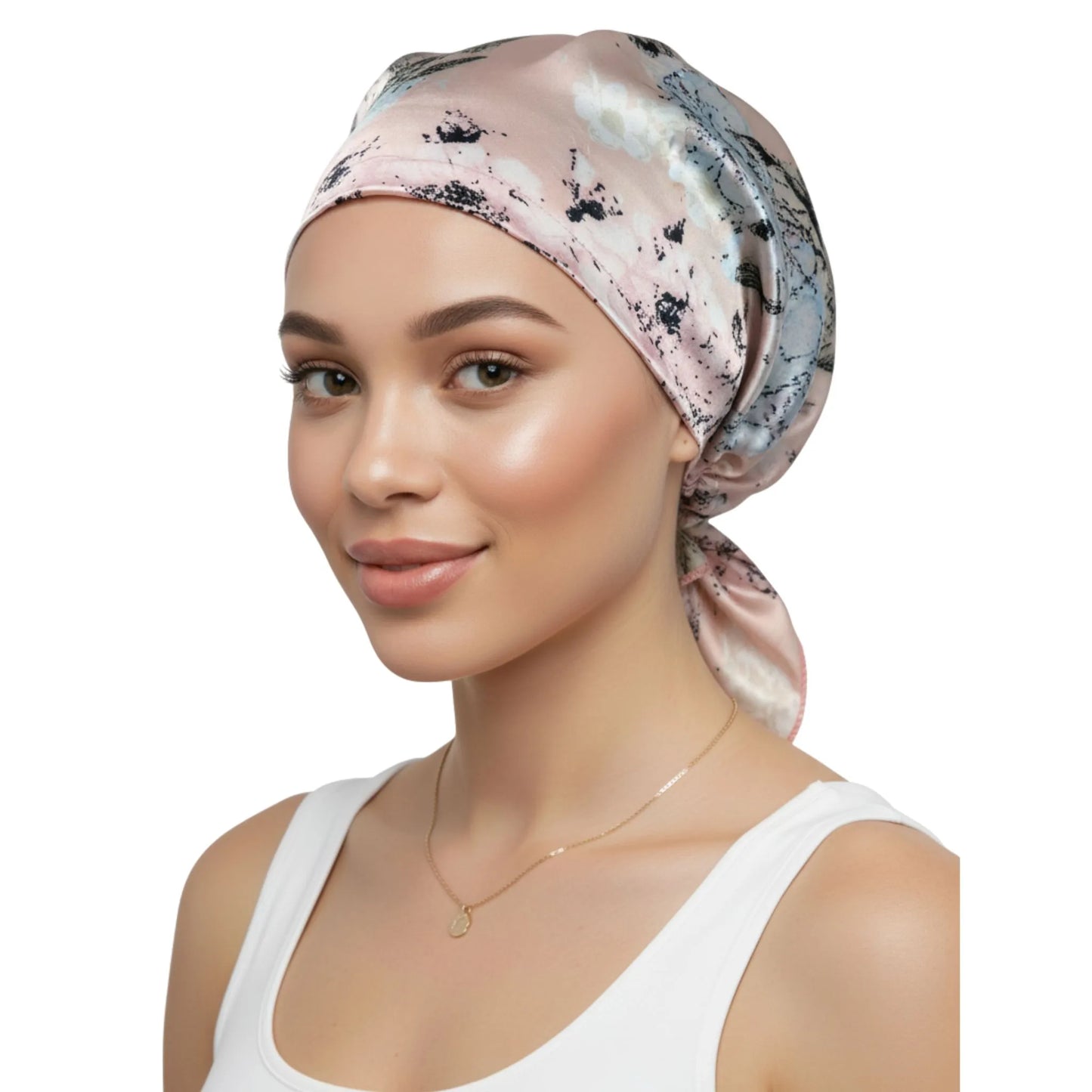 Woman wearing a patterned headscarf on a white background