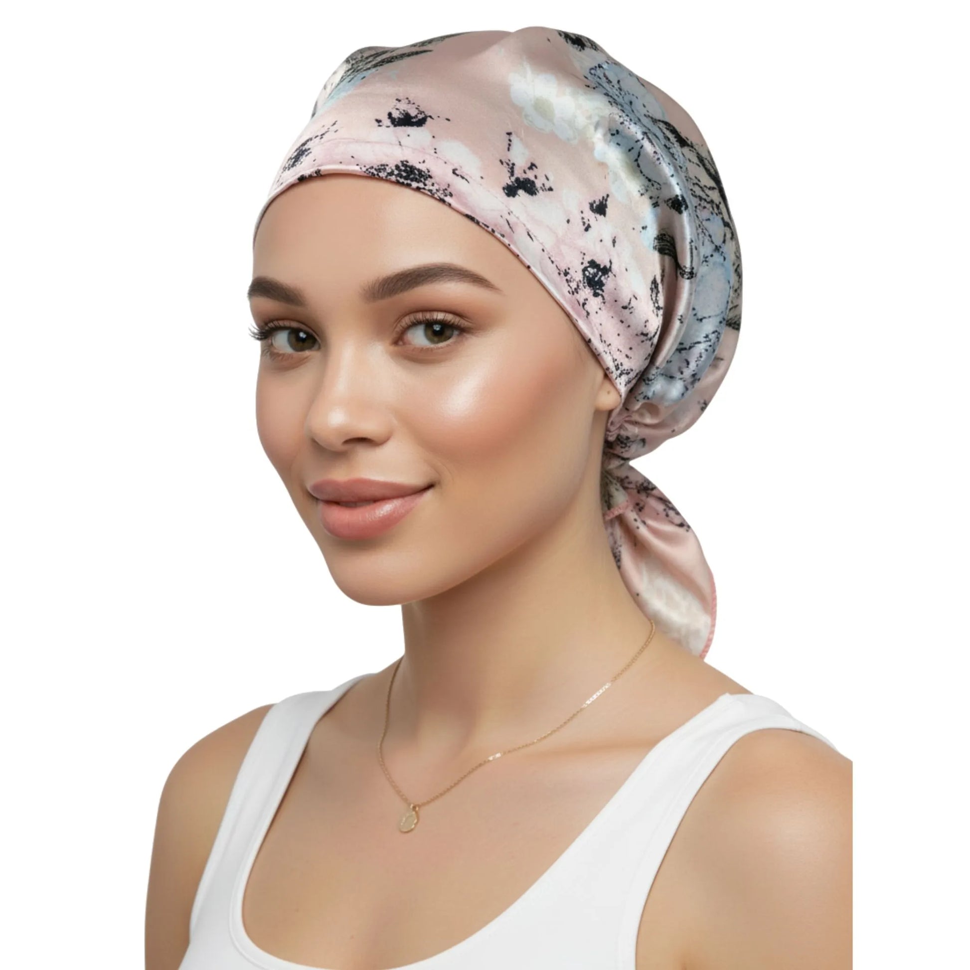 Woman wearing a patterned headscarf on a white background