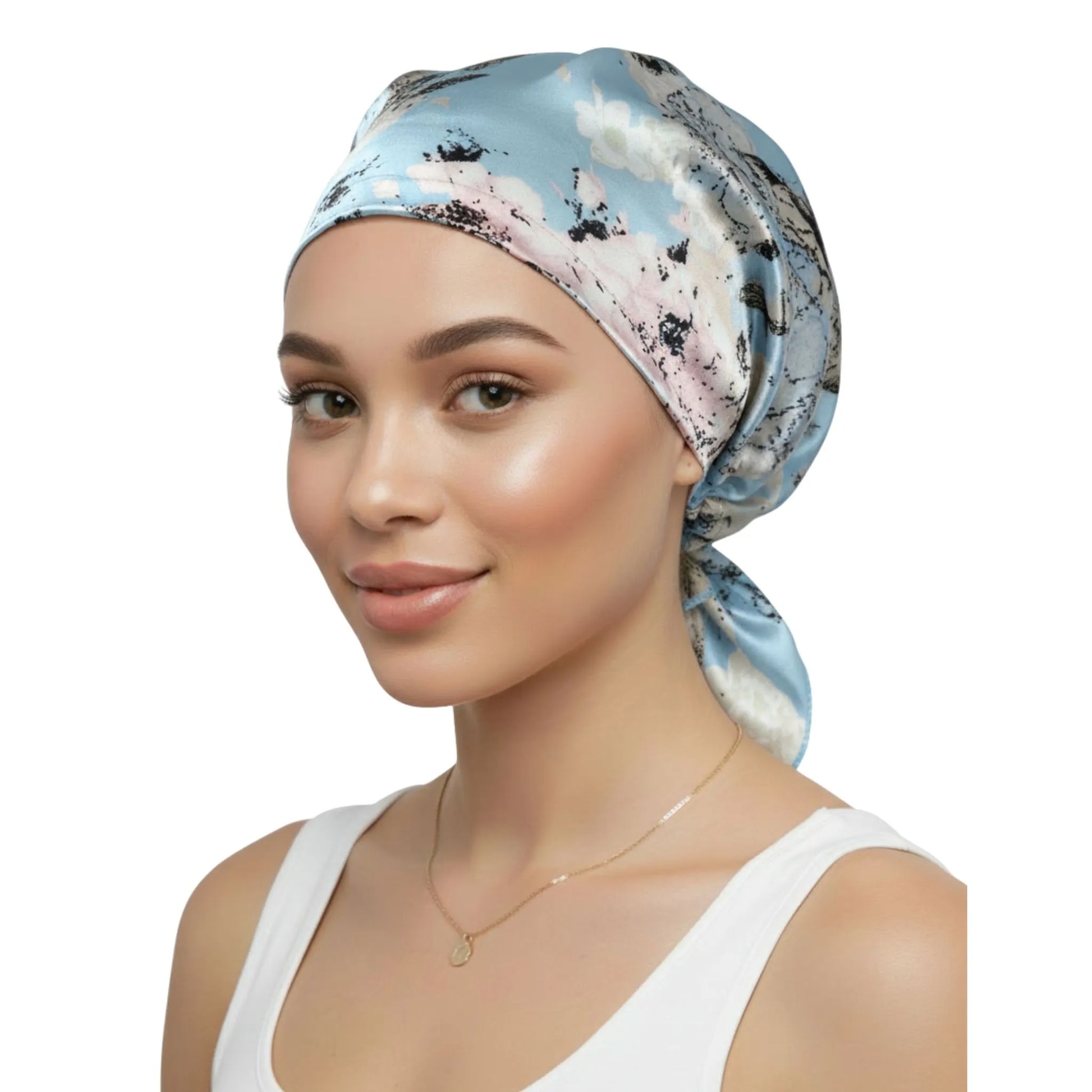 Woman wearing a patterned headscarf on a white background