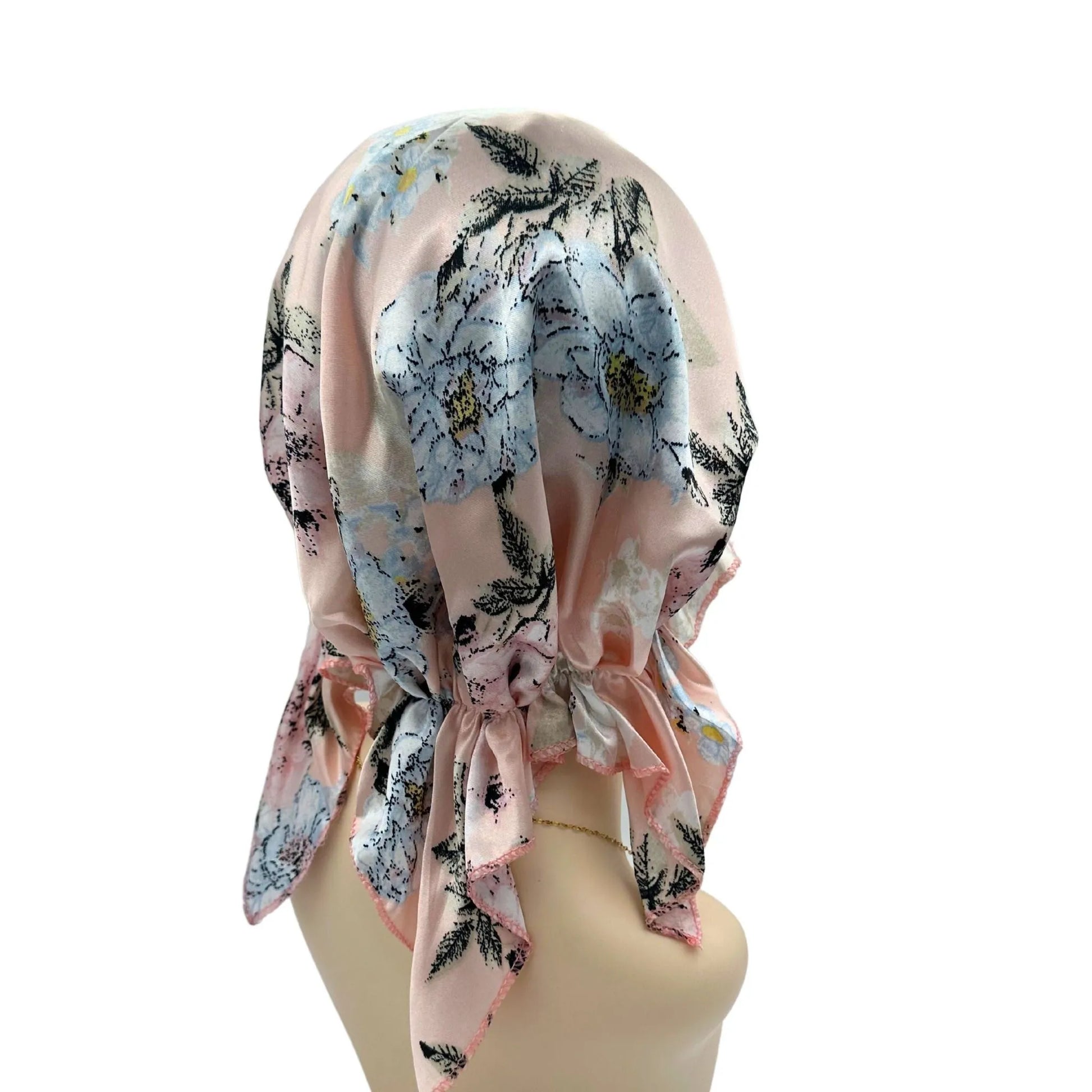 Floral headscarf on a mannequin against a white background