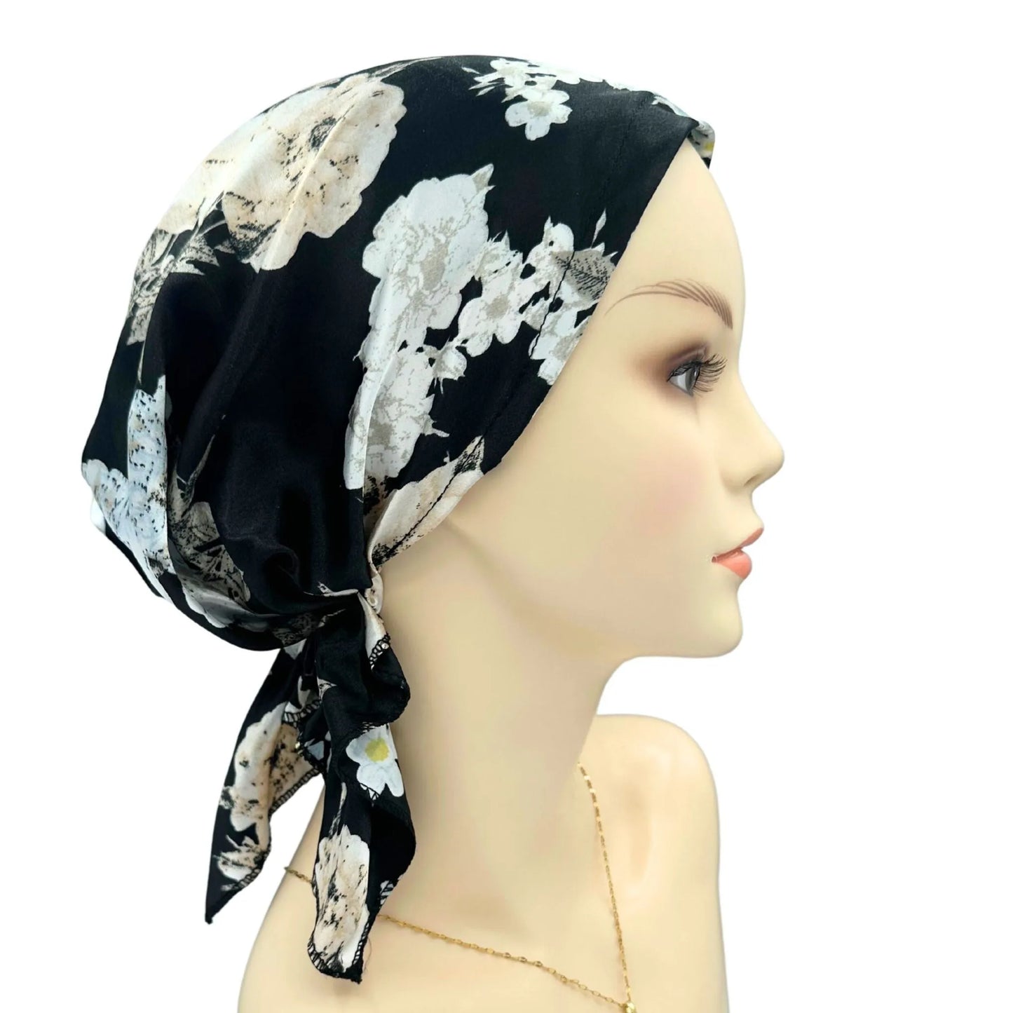 black floral satin headwear on a mannequin