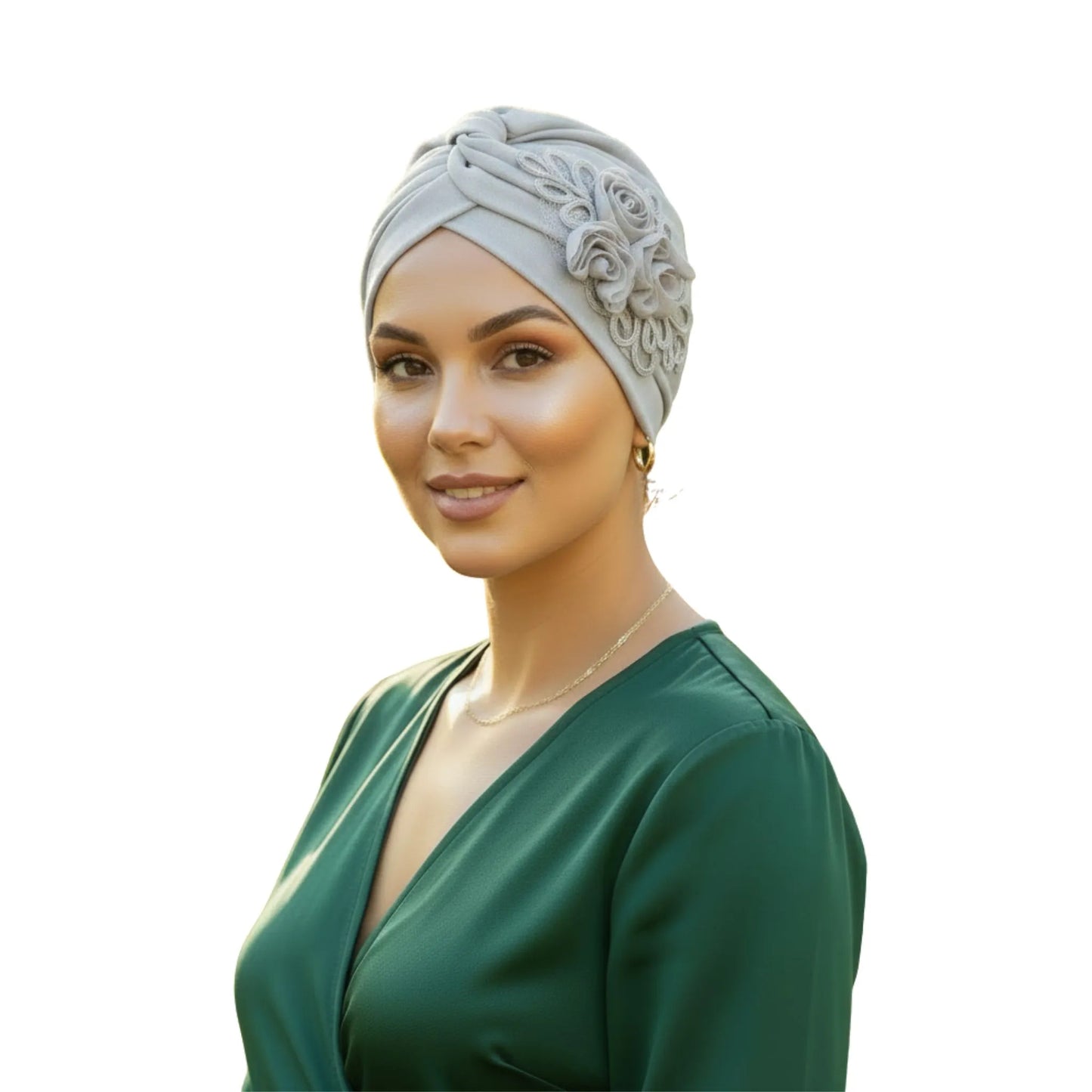 Woman wearing a light grey floral turban on white background