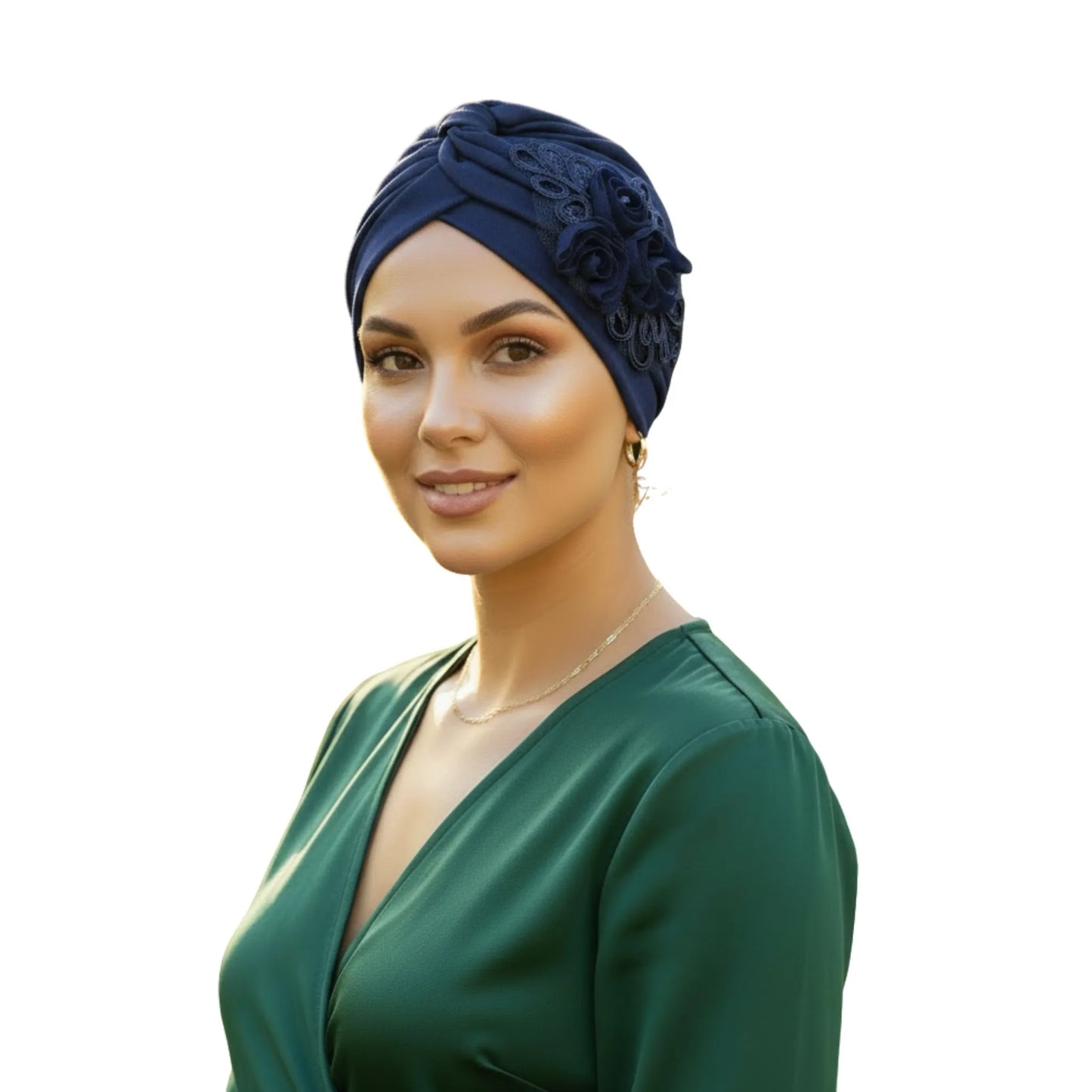 Woman wearing a navy blue floral turban on white background