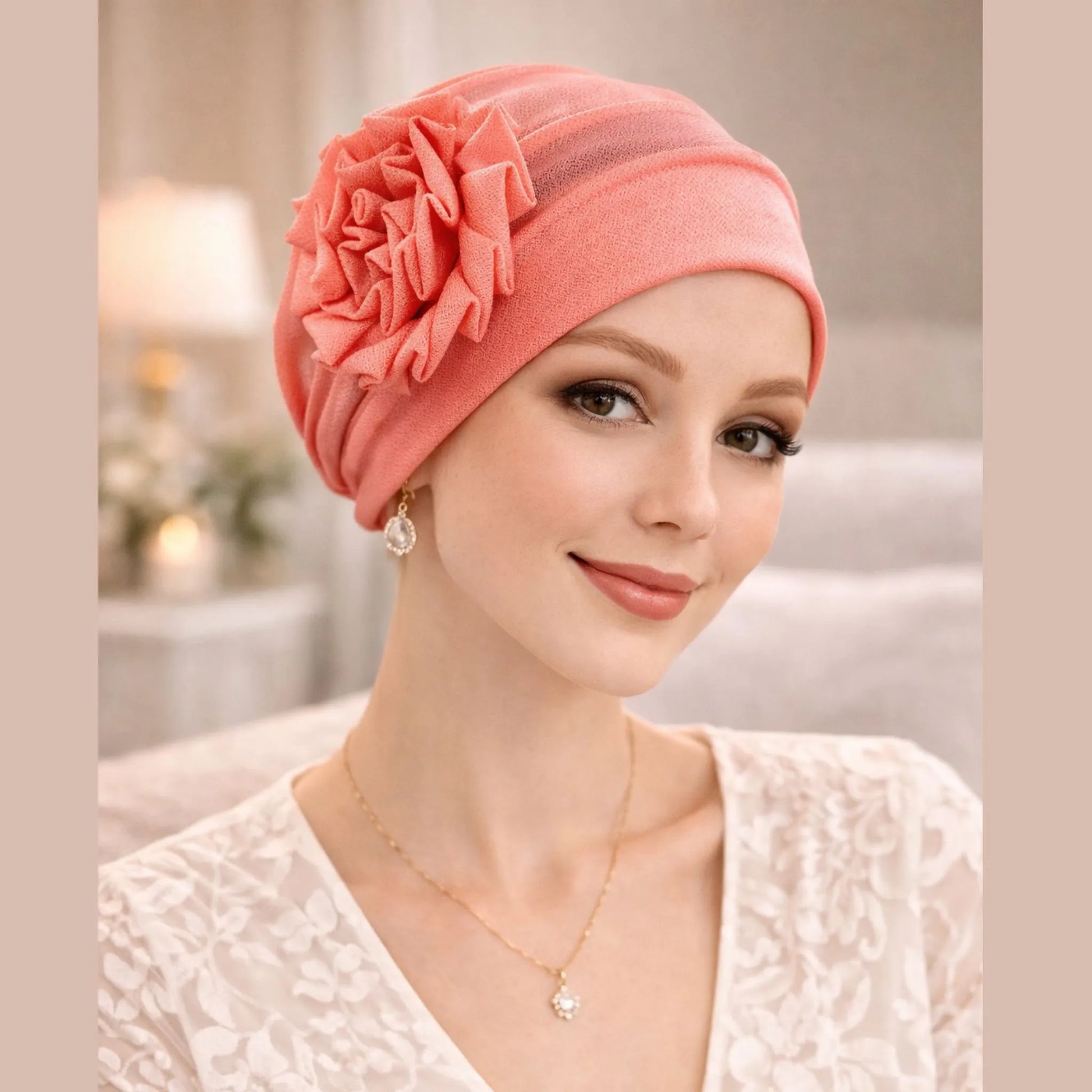 Woman wearing a orange hat with a flower accessory in an indoor setting